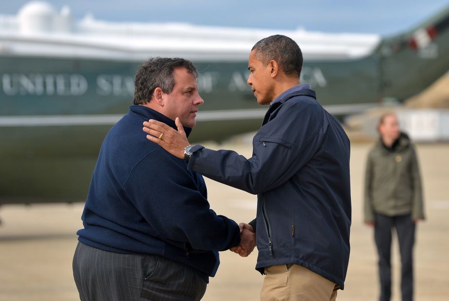 Christie greets President Barack Obama, who arrived in New Jersey to visit areas hit by Hurricane Sandy. The two <a href=