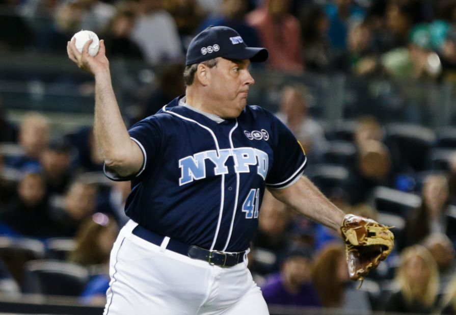 Christie throws to first base during the 